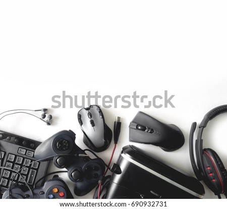 gamer workspace concept, top view a gaming gear, mouse, keyboard, joystick, headset, webcam, VR Headset on white background with copy space.
