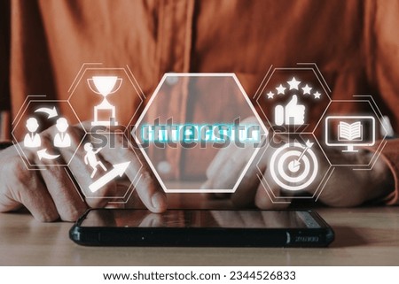 Gamification concept, Person hand using smart phone on desk with gamification icon on virtual screen.