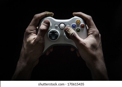 Gaming Addict - Dirty and damaged hands worn from playing too many computer/video games.