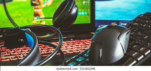 Gaming Computer, Laptop, Keyboard, Headphones And Mouse Headset For Video Gamer Games On A Dark Background With Copy Space, Concept Of The Latest Gaming Game Technology Long Banner