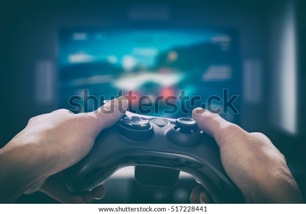 gaming game play tv fun gamer gamepad guy\
controller video console playing player holding hobby playful\
enjoyment view concept - stock\
image