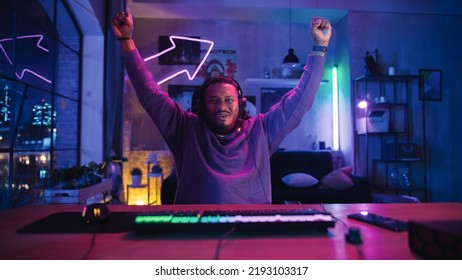 Gaming at Home: African American Gamer Celebrating After Victory in Online Video Game on Computer. Successful Black Man Winning in Online Multiplayer Tournament. POV from Screen Perspective.