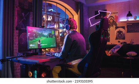 Gaming at Home: Attractive Female Gamer Playing Online Video Game on Personal Computer. Professional Stylish Female Player Enjoying 3D Shooter with Arcade Online Multiplayer PvP Battle on Screen.