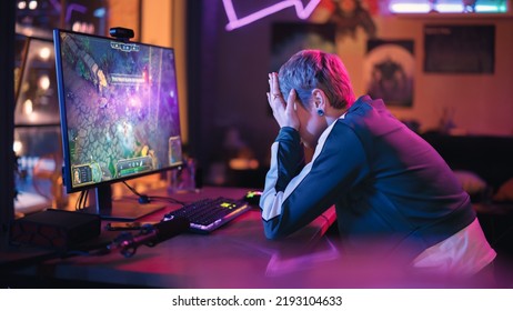 Gaming at Home: Gamer Frustrated by Losing a Round of Playing Online Video Game on Personal Computer. Saddened Female Playing RPG Strategy Arcade Online Multiplayer PvP Tournament. Evening at Home. - Powered by Shutterstock