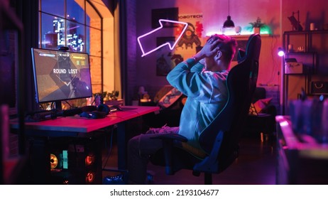 Gaming at Home: Gamer Sad and Angry After Losing a Round of Playing Online Video Game on Personal Computer. Stylish Male Playing Shooter Online Multiplayer PvP Battle. Creative Living Room. - Powered by Shutterstock