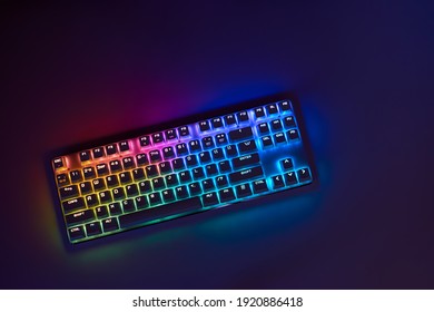 Gaming keyboard with RGB light. White mechanical keyboard. Gamer's workspace, neon light - Shutterstock ID 1920886418