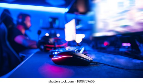 Gaming Mouse And Keyboard For Professional Esportsman In Neon Flowers, Soft Focus.