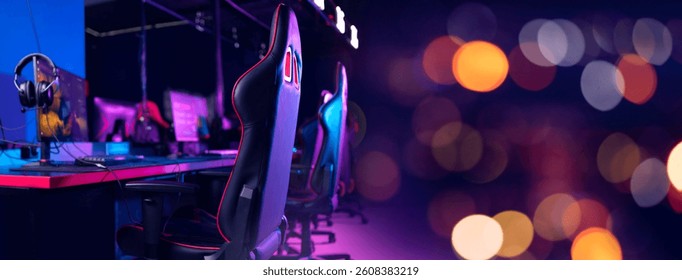 Gaming setup in neon-lit esports arena with advanced equipment and headset.