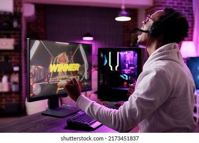 Gaming vlogger winning action video games tournament on live stream, celebrating online gameplay championship win on pc. Modern player streaming rpg esport competition on internet.