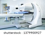 Gamma camera in the parlor of the clinic of nuclear medicine. Medical equipment in the hospital. Body examination equipment. The patient undergoes a medical examination.
