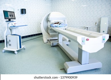 Gamma Camera In The Parlor Of The Clinic Of Nuclear Medicine. Medical Equipment In The Hospital. Body Examination Equipment. The Patient Undergoes A Medical Examination.
