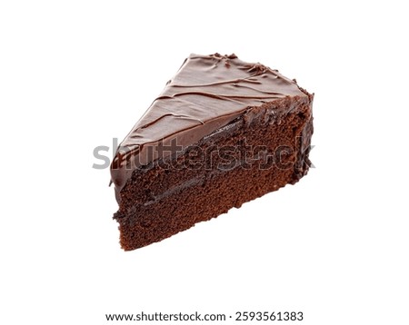 Ganache frosting with chocolate cake slice isolated on white background.