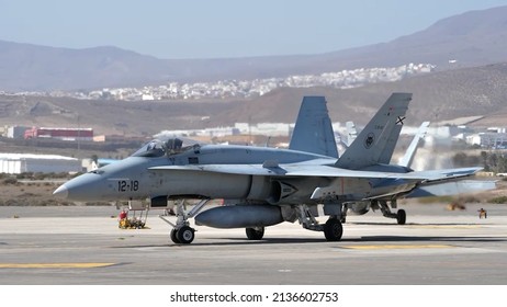 Gando Airport Gran Canaria Spain OCTOBER, 21, 2021 Air defense jet parked with arid mountains in the background. Side view with copy space. McDonnell Douglas F-18 Hornet of Spanish Air Force