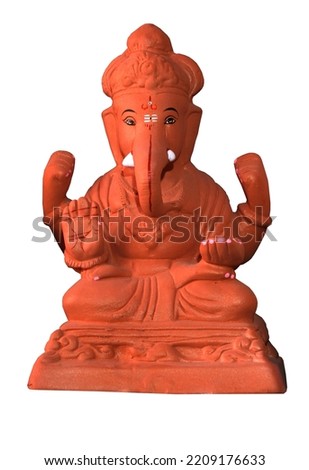 Ganesha or Ganapati on white background, Eco friendly God Ganesha Statue made from clay, selective focus.