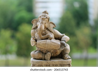 Ganesha Hindu God statue close up on natural background