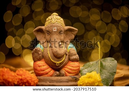 Ganesha idol made out of clay, husk and dung.