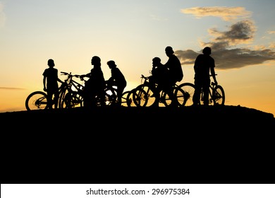 A Gang Doing Bike With A Yellow Sunset