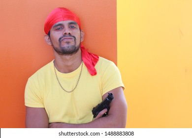 Gang Member Holding A Gun 