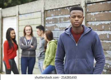 Gang Of Teenagers Hanging Out In Urban Environment