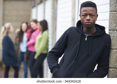 Gang Of Teenagers Hanging Out In Urban Environment