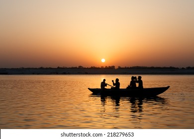 Ganges River And Tourists On The Boat With Rising Sun.