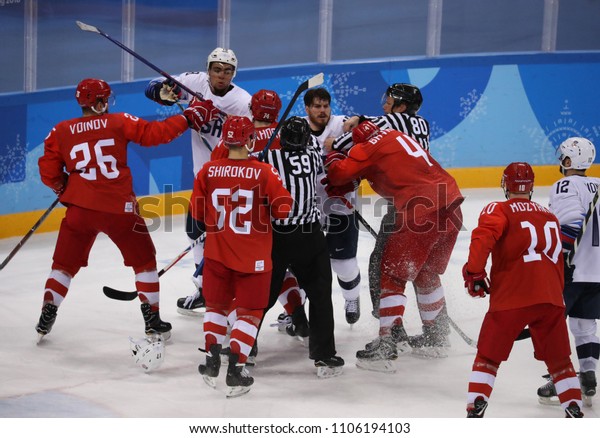 GANGNEUNG, SOUTH KOREA - FEBRUARY 17, 2018: Team\
United States (in white) in action against Team Olympic Athlete\
from Russia Men`s ice hockey preliminary round game at 2018 Winter\
Olympic Games