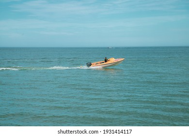 Gangneung, South Korea-August 2020: People Driving Yellow Jetski At The Ocean Beach And Blue Sky