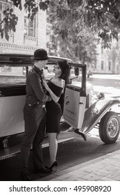 Gangsta Love. Man And Woman Hugging Near A Retro Car