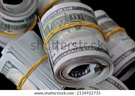 Gangster roll, bankroll, money roll, bundle of dollar money cash. Currency banknotes.