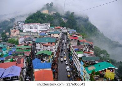 Gangtok, Sikkim - June 16 2022, Tourists Enjoy A Rope Way Cable Car Ride Over Gangtok City. Amazing Aerial City Scape Of Sikkim. Covered In Mist Or Fog. North East India Tourism,  Aerial Cityscape.