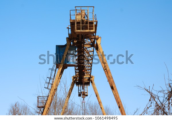 Gantry crane against the blue\
sky