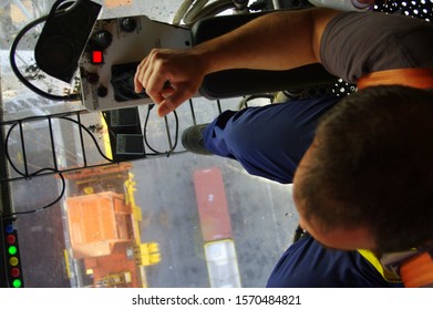  Gantry Crane Operator Moving A Sea Container In The Port