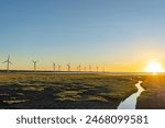Gaomei Wetlands Area wind turbines in sunset time, a flat land which spans over 300 hectares, also a popular scenic spots in Qingshui District, Taichung City, Taiwan