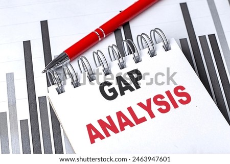 GAP ANALYSIS text on a notebook on chart with pen . 