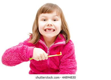 Gap Toothed Girl Brushing Her Teeth Isolated On White