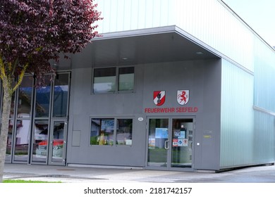 Garage Building With Red Doors Volunteer Fire Brigade In Austria, Volunteering Concept, Fire Fighting And Community Assistance, Innsbruck, Austria - June 2022