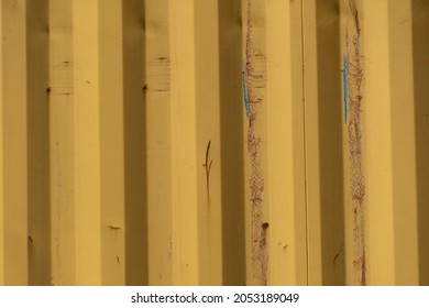 Garage Corrosion On A Rough Striped Metal Wall Or Floor, Scratches, Air Holes, Rusty House Fence, Holes, Dents, Pins.