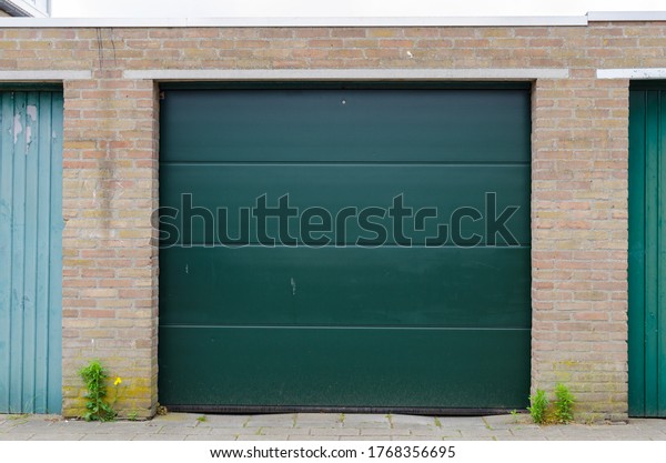 Garage with a curtain metal\
door. 