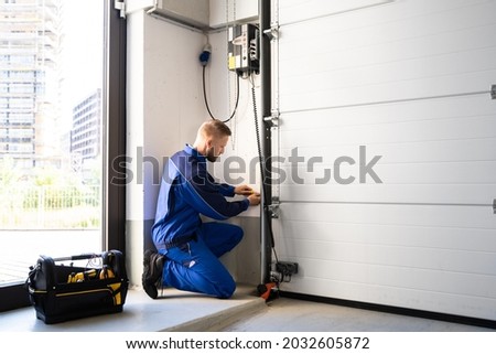 Garage Door Installation And Repair At Home. Contractor Man In House Сток-фото © 