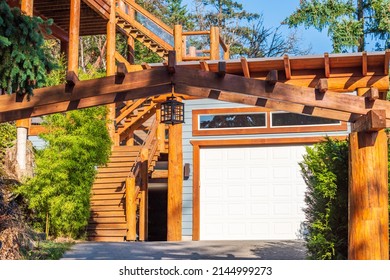 Garage door in luxury house with trees and nice landscape