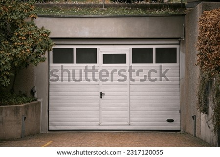 Garage door. Luxury and modern house with double garage door in Europe.