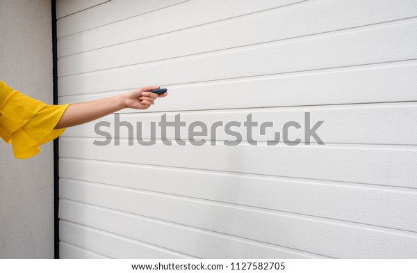 Garage door PVC. Hand use remote controller for
closing and opening garage
door