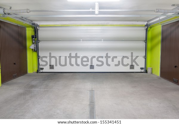 Garage door. Underground garage located under\
modern house estate block of\
flats