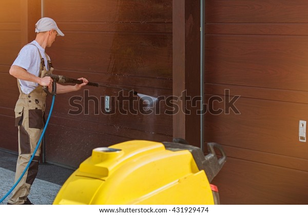 Garage Door Washing By High Pressured Royalty Free Stock Image