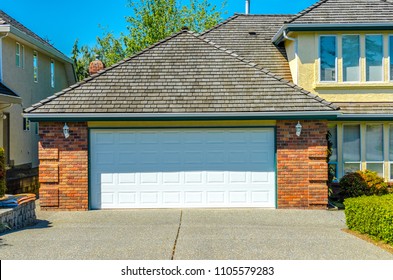 Garage, Garage Doors And Driveway.