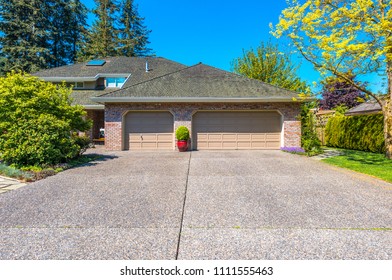 Garage, Garage Doors And Driveway.