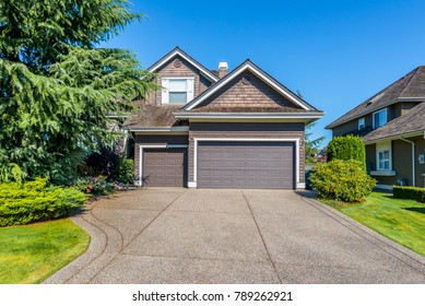 Garage, Garage Doors And Driveway.