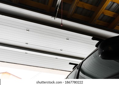 Garage Entrance With Sectional Doors. View Of The Automatic Garage Door From The Inside