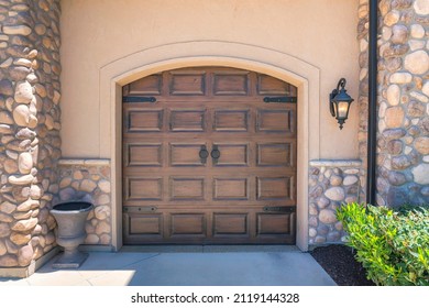 Garage Exterior Of A House With French Style Dark Wood Doors