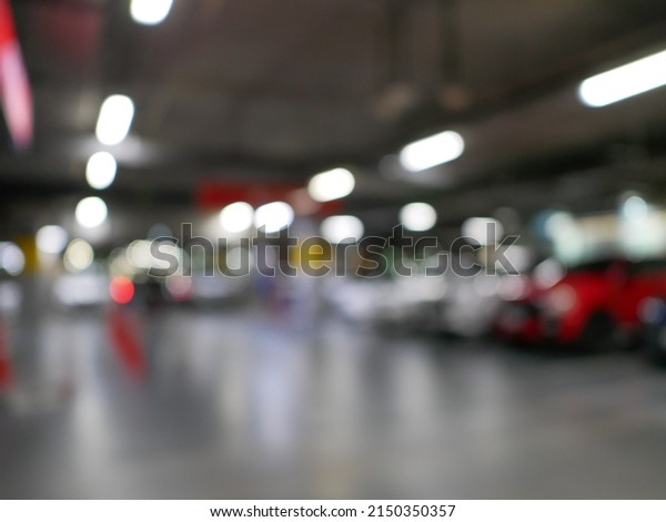 Garage interior blurred. Car lot parking space in
underground city garage. Empty road asphalt background in soft
focus. Large private
garage